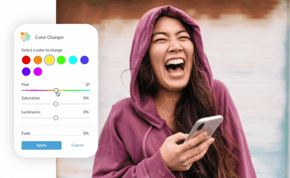 Color changer tool for photos shown in PicMonkey editor. Picture of brunette with long hair in a hoodie and holding iPhone laughing.